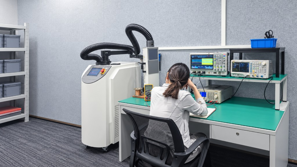 Engineer validating electronic hardware at a laboratory bench
